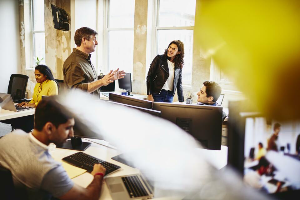 Group in an office having a conversation